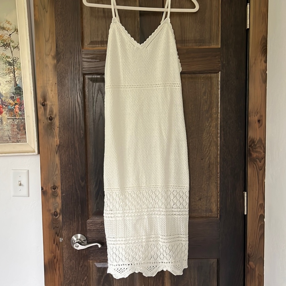 Knee length, white knit dress. Size Medium. Worn once for bridal shower.